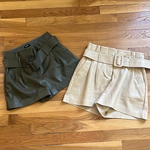 2 pair faux leather belted paper bag shorts. Size 2. Express.